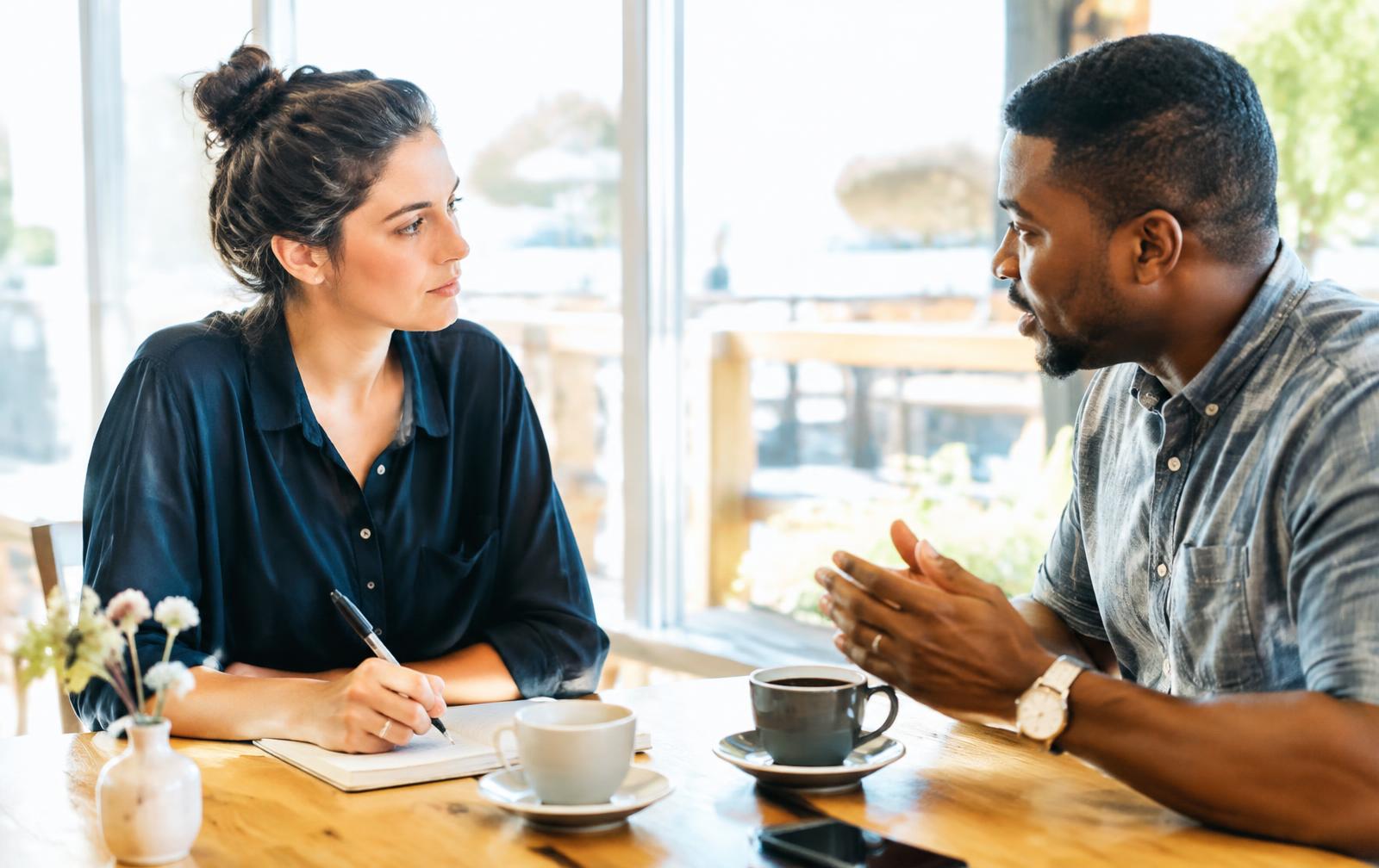 Two entrepreneurs in a focused working conversation